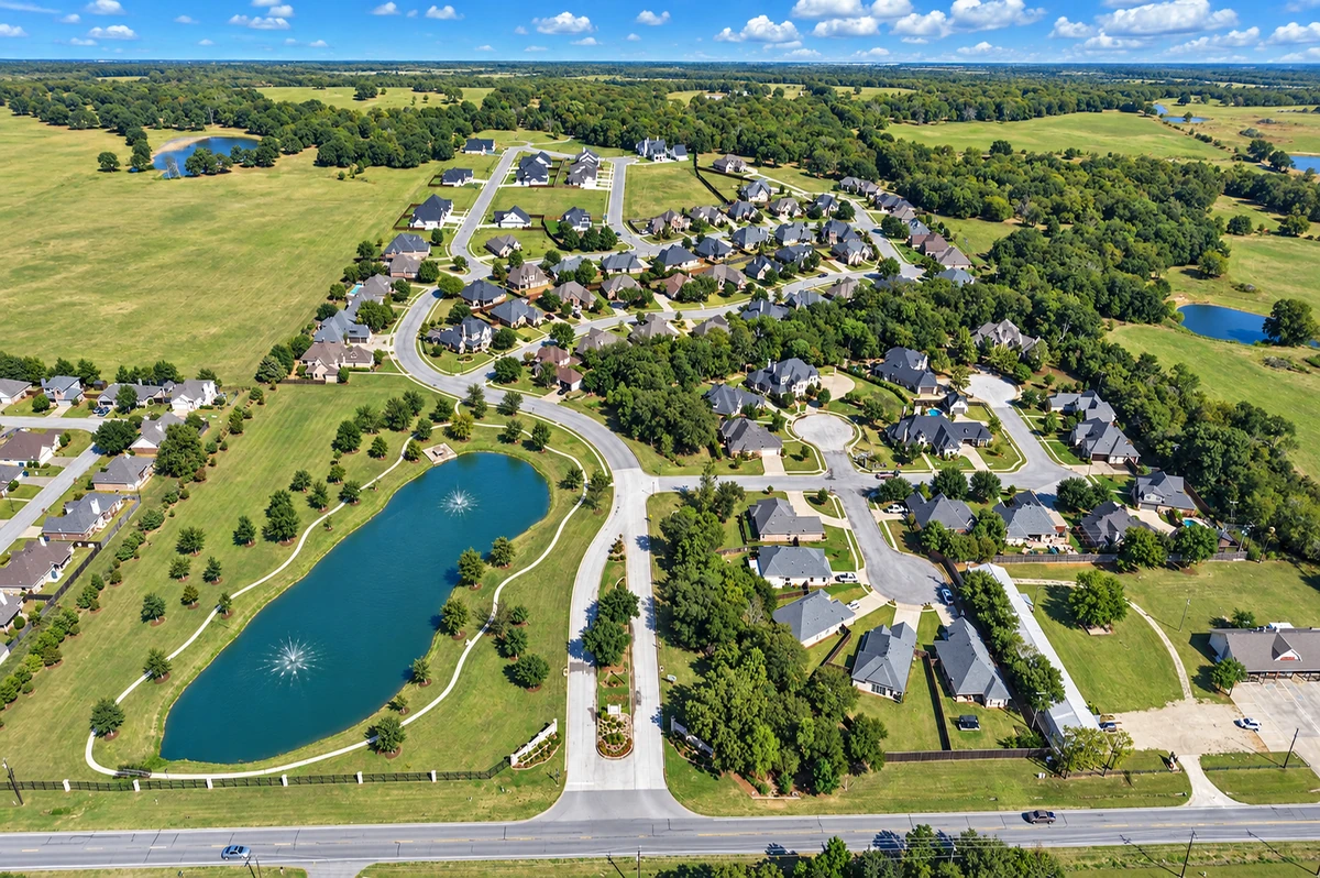 Fountain Creek Estates homes and neighborhood streets from above in Pottsboro
