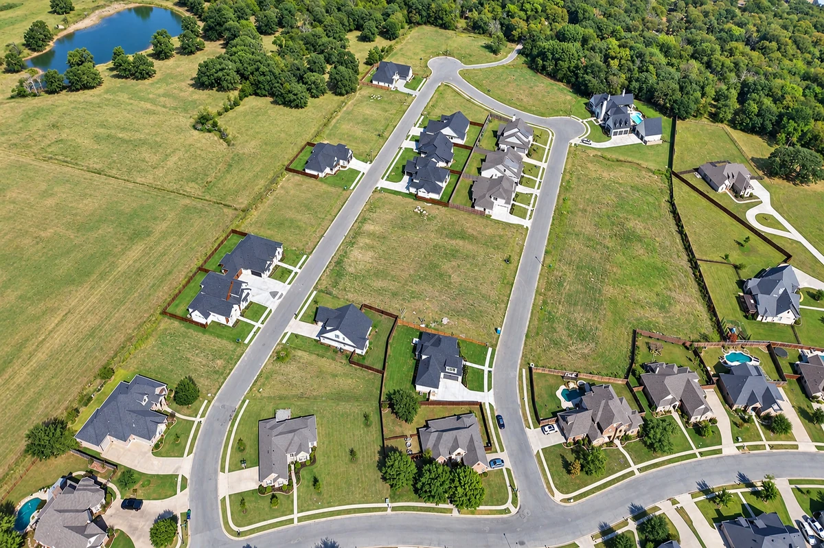Fountain Creek Estates homes and neighborhood streets from above in Pottsboro